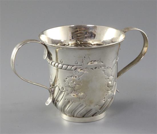 An early George III repousse demi fluted silver porringer by Fuller White, 6.5 oz.